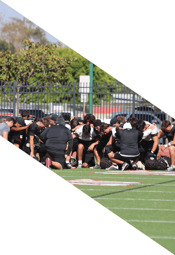 A group of young men wearing black and white uniforms are standing on a field. AI generated content