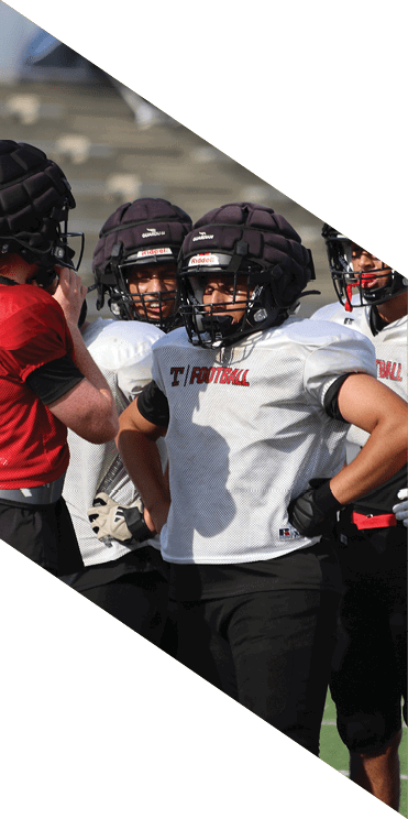 A group of football players wearing headphones and smiling. AI generated content