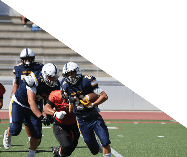 A group of football players kneeling on the field, some with their hands on their heads. AI generated content