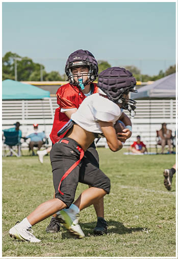 A group of football players celebrating a touchdown. Description generated by AI