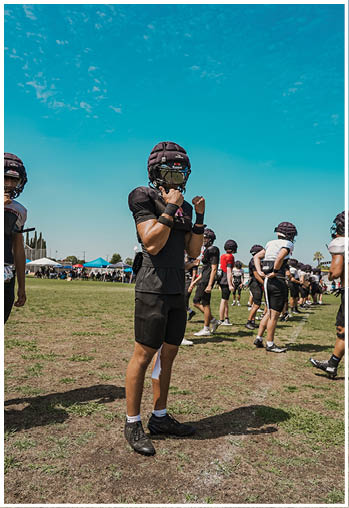 A group of football players celebrating a touchdown. Description generated by AI
