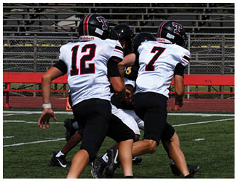 A group of football players on a field. Description generated by AI
