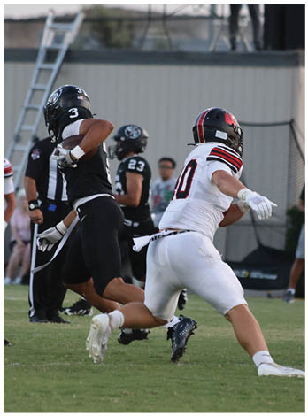 A football player wearing a blue jersey with the number 58 on it. Description generated by AI