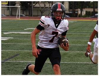A group of football players on a field. Description generated by AI