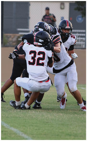 A football player catching a ball. Description generated by AI