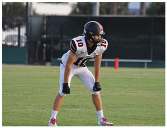 A group of football players on a field. Description generated by AI