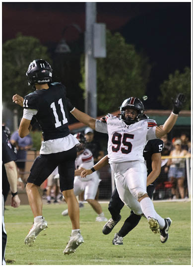 A football player wearing a blue jersey with the number 58 on it. Description generated by AI