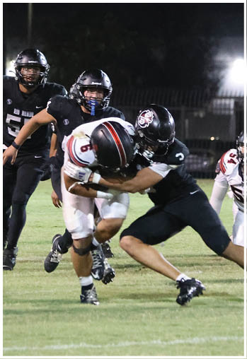 A group of football players celebrating a touchdown. Description generated by AI