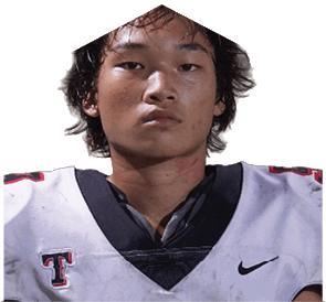 A young man wearing a white jersey with the number 10 on it. Description generated by AI