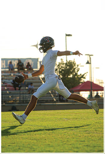 A group of football players celebrating a touchdown. Description generated by AI
