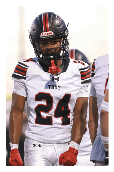 A football player wearing a black and white uniform with the number 10 on the back. AI generated content