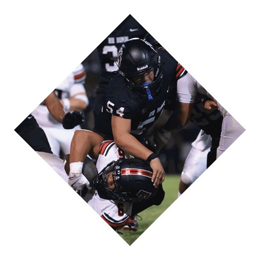 A female football player is kicking a football on a field. AI generated content