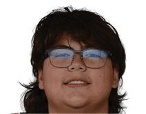 A young man wearing a white jersey with the number 10 on it. Description generated by AI