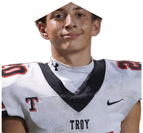 A young man wearing a white jersey with the number 10 on it. Description generated by AI