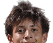 A young man wearing a white jersey with the number 10 on it. Description generated by AI