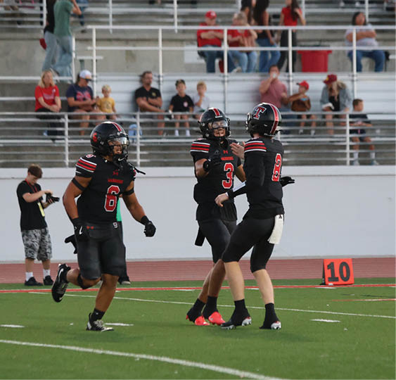 A group of football players celebrating a victory. AI generated content