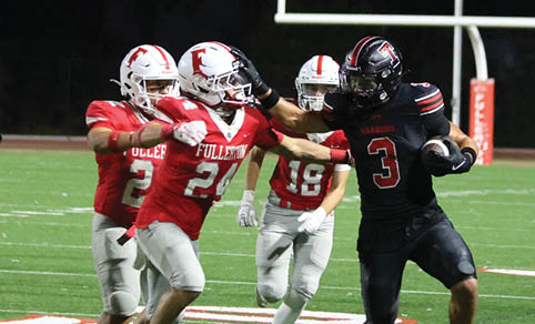 Two men wearing football uniforms are hugging each other on a field. AI generated content