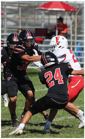 A football player catching a ball. Description generated by AI
