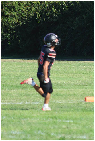 A football game is being played on a field. Description generated by AI