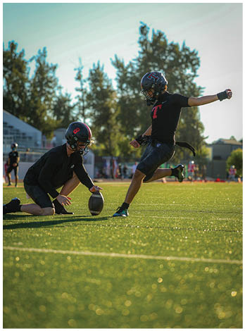 A football player wearing a blue jersey with the number 58 on it. Description generated by AI