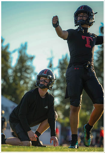 A group of football players celebrating a touchdown. Description generated by AI