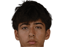 A young man wearing a white jersey with the number 10 on it. Description generated by AI