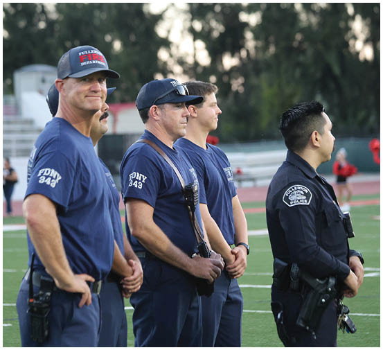 A group of football players on a field. Description generated by AI