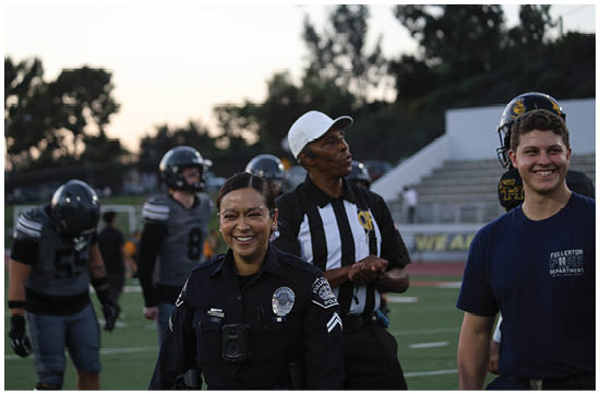 A group of football players on a field. Description generated by AI