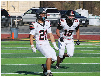 A group of football players on a field. Description generated by AI