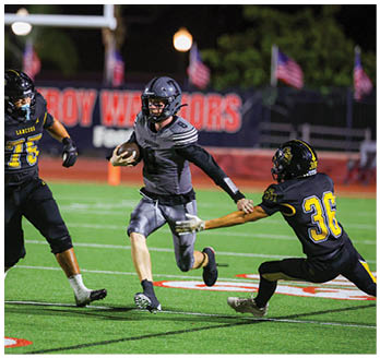 A football player running on the field. Description generated by AI