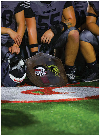 A football player wearing a blue jersey with the number 58 on it. Description generated by AI