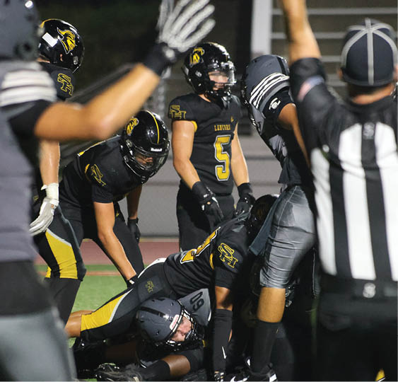 A group of football players celebrating a victory. AI generated content