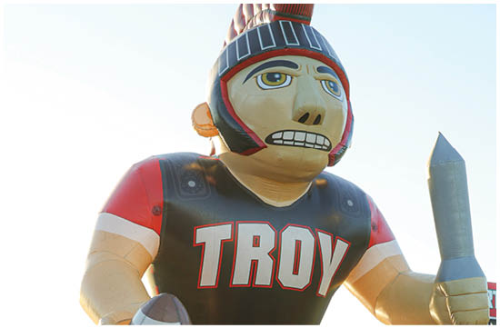 A group of football players on a field. Description generated by AI