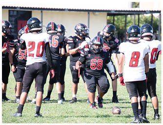 A group of football players on a field. Description generated by AI