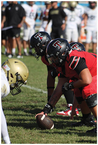 A football game is being played on a field. Description generated by AI