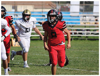 A group of football players on a field. Description generated by AI
