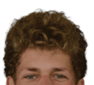A young man wearing a white jersey with the number 10 on it. Description generated by AI