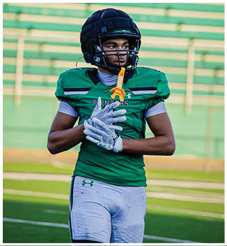 A football player catching a ball. Description generated by AI