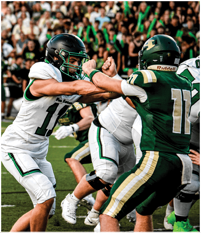 A group of football players wearing black and white uniforms. Description generated by AI