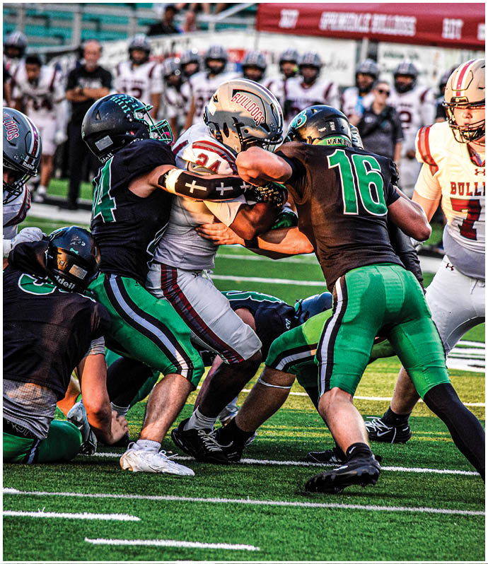 A group of football players wearing black and white uniforms. Description generated by AI