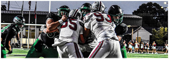 A group of football players on a field. Description generated by AI