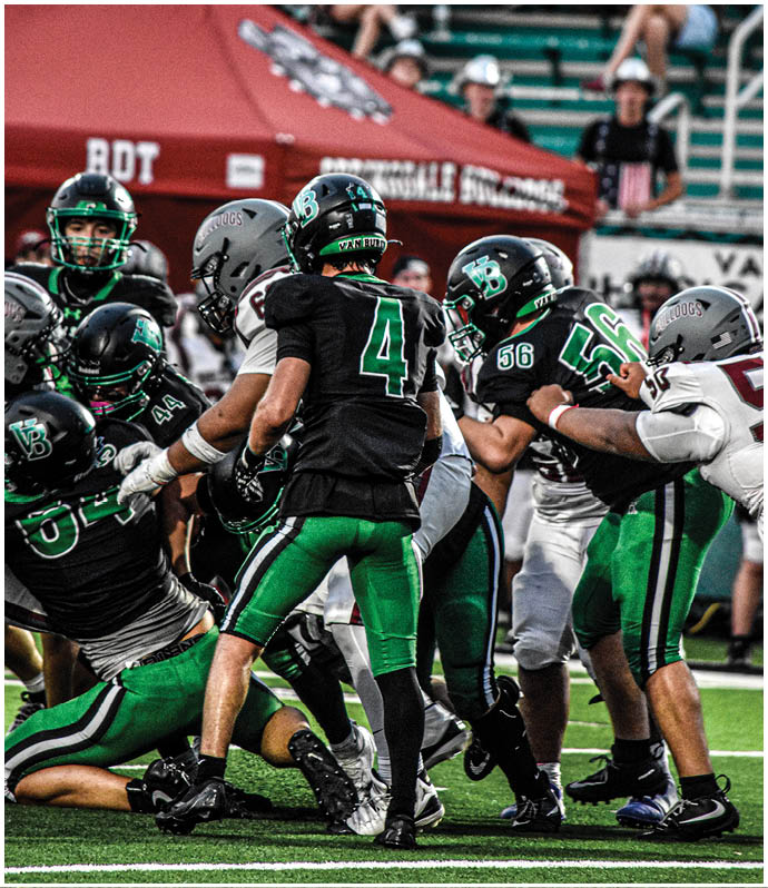 A group of football players wearing black and white uniforms. Description generated by AI