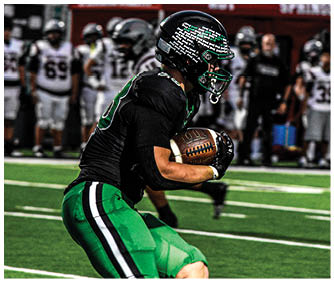 A football player running on the field. Description generated by AI