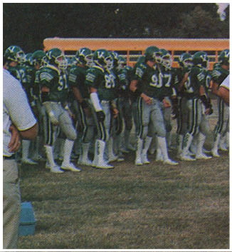 A football game is being played on a field. Description generated by AI