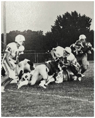 A football game is being played on a field. Description generated by AI