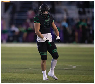 A football player catching a ball. Description generated by AI