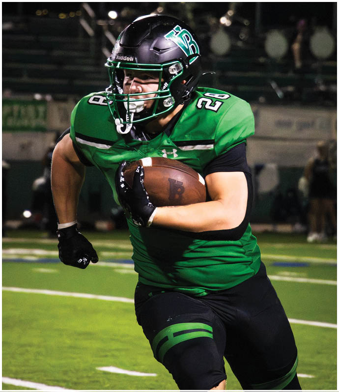 A group of football players wearing black and white uniforms. Description generated by AI