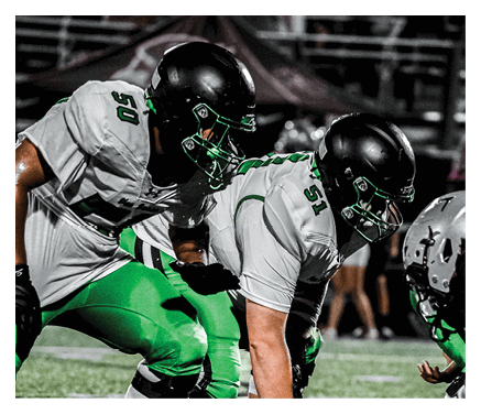 A group of young men wearing black jerseys with the word “Vista" on the front are celebrating a victory. AI generated content