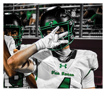 Two football players celebrating a touchdown with one player jumping in the air. AI generated content