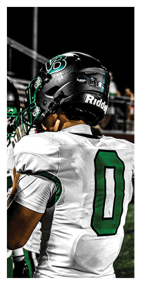 A man in a green shirt and black pants is preparing to throw a football. AI generated content